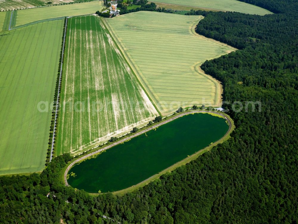 Tübingen from the bird's eye view: The water reservoir in the Pfrondorf part of the city of Tübingen in the state of Baden-Württemberg. The reservoir is located amidst fields on the edge of a wood in the North Eastern part of the town