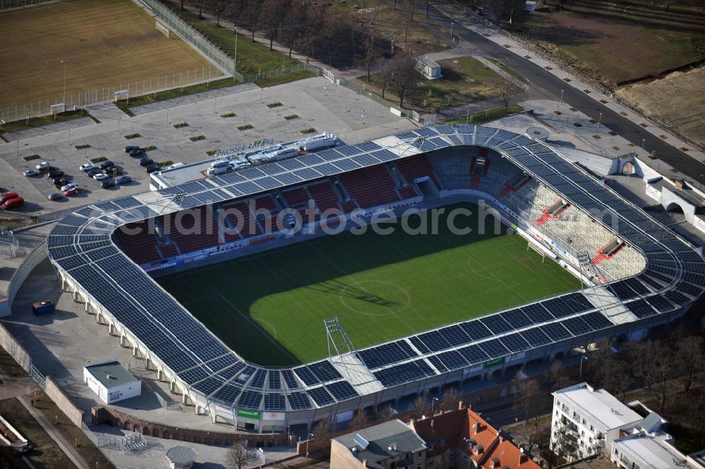 Halle / Saale from the bird's eye view: Look at the Erdgas sports parkl, a football stadium that was opened in 2011. It was built on theground of the old Kurt Wabbel stadium that was demolished in summer 2010. The exterior wall and the arches of the historic stadium are landmarked so that the new stadium had to retain those. The costs of around € 17 million was shared by the town and the state of Saxony-Anhalt. The new stadium has a capacity of 15 057 seats and stands. On the roof has been installed a photovoltaic system. Primary user is the football club Hallescher FC