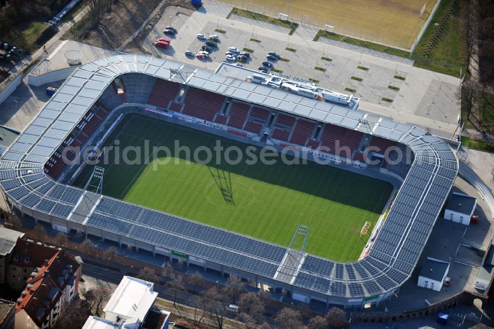 Aerial photograph Halle / Saale - Look at the Erdgas sports parkl, a football stadium that was opened in 2011. It was built on theground of the old Kurt Wabbel stadium that was demolished in summer 2010. The exterior wall and the arches of the historic stadium are landmarked so that the new stadium had to retain those. The costs of around € 17 million was shared by the town and the state of Saxony-Anhalt. The new stadium has a capacity of 15 057 seats and stands. On the roof has been installed a photovoltaic system. Primary user is the football club Hallescher FC