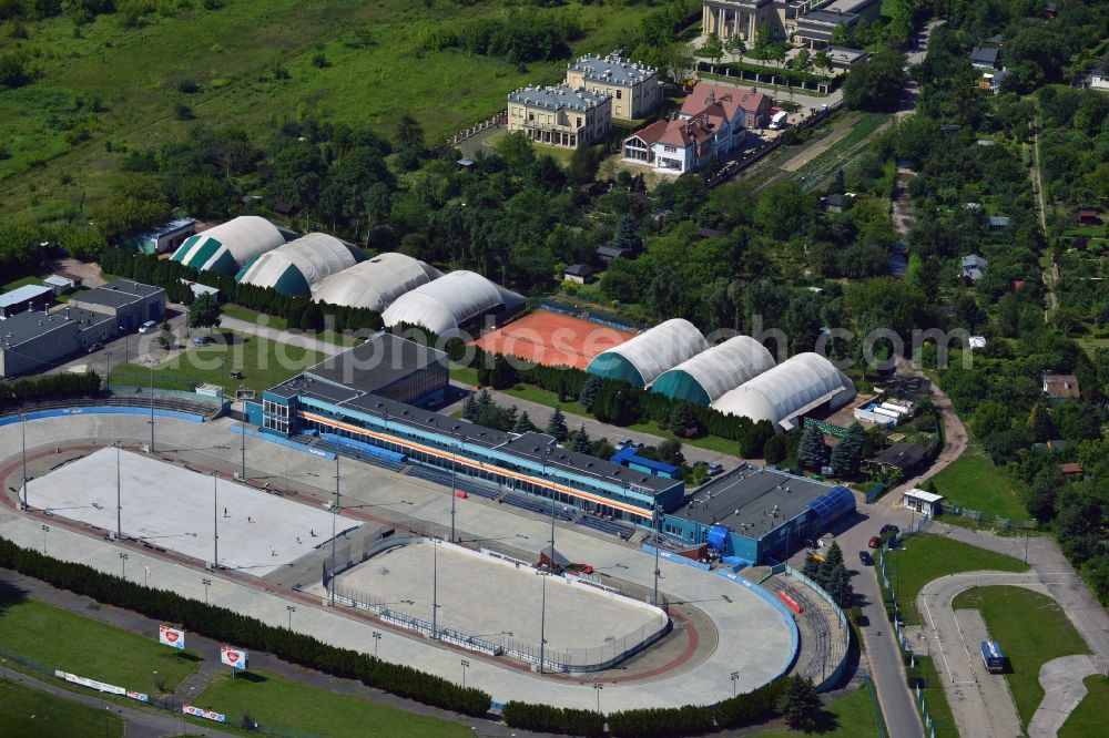 Warschau from the bird's eye view: Stegny sports facilities in the Mokotow District in Warsaw in Poland. The facilities include a large, oval ice rink and an ice hockey field. In summer, tennis courts, halls and track and field facilities can be used. The compound is located in the East of the district on the motorway A2