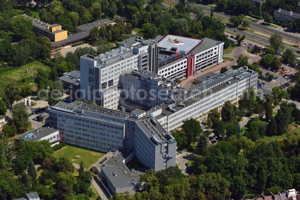 Warschau from above - The Central Clinical Hospital of the Ministry of Interior in Warsaw in Poland. The hospital has been on site in the Wygledow part of the district of Mokotow since 1951. Starting in 1998 it was modernised and refurbished. The building with the heli pad was added during that time. The hospital is home to all important clinical departments