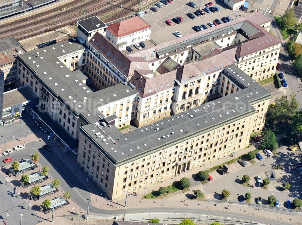 Aerial photograph Saarbrücken - Geschäftsgebäude des Verkehrsunternehmens Deutschen Bahn neben dem Hauptbahnhof Saarbrücken im Saarland. Die Deutsche Bahn AG löste mit ihrer Gründung 1994 die hier vorher ansässige ehemalige Bundesbahndirektion Saarbrücken ab. Business building of German transportation company Deutsche Bahn next to Saarbrücken Central Station in state Saarland. With its formation in 1994, corporation Deutsche Bahn AG detached the former located German Federal Railways Administration Saarbrücken.