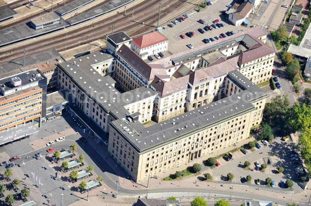 Saarbrücken from above - Geschäftsgebäude des Verkehrsunternehmens Deutschen Bahn neben dem Hauptbahnhof Saarbrücken im Saarland. Die Deutsche Bahn AG löste mit ihrer Gründung 1994 die hier vorher ansässige ehemalige Bundesbahndirektion Saarbrücken ab. Business building of German transportation company Deutsche Bahn next to Saarbrücken Central Station in state Saarland. With its formation in 1994, corporation Deutsche Bahn AG detached the former located German Federal Railways Administration Saarbrücken.