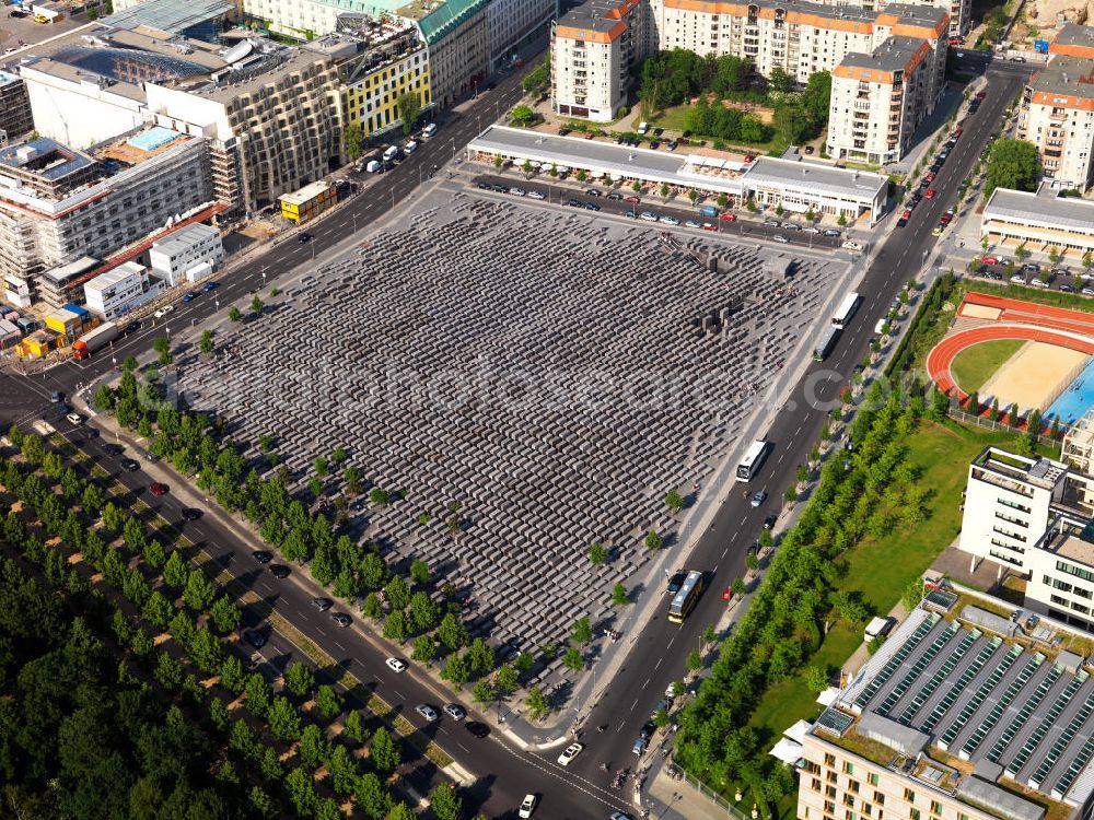 Berlin from above - The Memorialto the Murdered Jews of Europe in the centre of Berlin is Germany's central Holocaust memorial site, a place for remembrance and commemoration of six million victims. The Memorial consists of the Field of Stelae designed by architect Peter Eisenman and the underground Information Centre and is maintained by a Federal Foundation