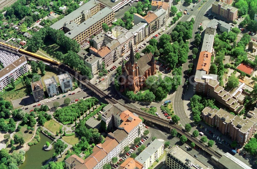 Aerial image Berlin - View of the publice square Dennewitzer Platz with the Luther Church in Berlin-Schöneberg. The Neo-Gothic church near the subway station Buelowstrasse was built in the end of the 19th Century