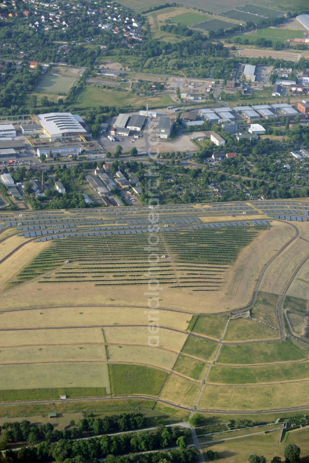 Magdeburg from the bird's eye view: View of the solar park in Magdeburg in Saxony-Anhalt. Under the direction of the WSB group, there was built the solar park within 5 months on the former domestic waste landfill Cracauer Anger, which was closed in 1998. The plant went into operation in December 2011