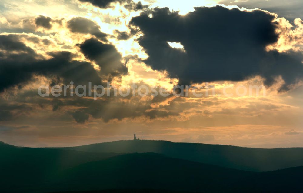 Aerial photograph Schmitten - View of the mountain Grosser Feldberg in the evening sun, the highest mountain in the southwestern part of the Taunus mountains of Central Hesse. The mountain, whose top area is deforested, is a popular tourist destination