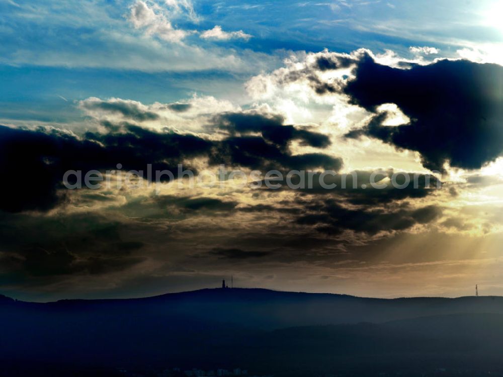 Aerial photograph Schmitten ( Hochtaunus ) - View of the mountain Grosser Feldberg in the evening sun, the highest mountain in the southwestern part of the Taunus mountains of Central Hesse. The mountain, whose top area is deforested, is a popular tourist destination