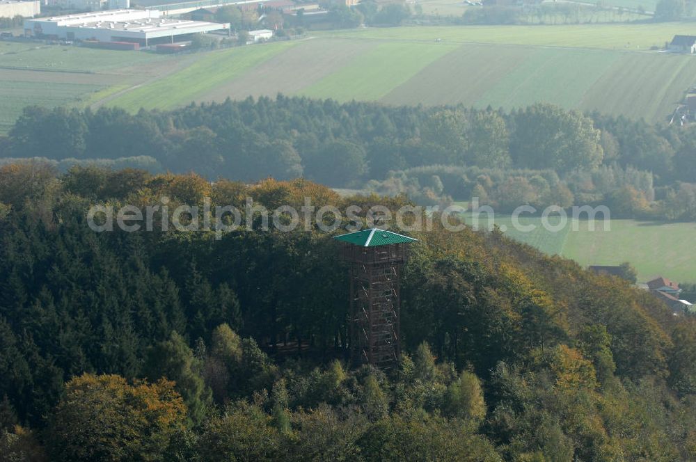 Aerial photograph Marienmünster - Blick auf den Aussichts- und Museumsturm. Der Turm wurde 2008 nach Plänen von Andrea Hecker errichtet und hat eine Höhe von 26 m. Er steht auf dem Hungerberg, der wiederum eine Höhe von 325 m hat. Der Turm besteht aus einer äußeren und einer inneren Konstruktion, beide sind komplet aus Holz gefertigt. Kontakt: Heimat- und Kulturverein Marienmünster, Vereinsvorsitzender Heinrich Fiene, Schulstraße 8, 37696 Marienmünster, Tel. 05276 / 8181