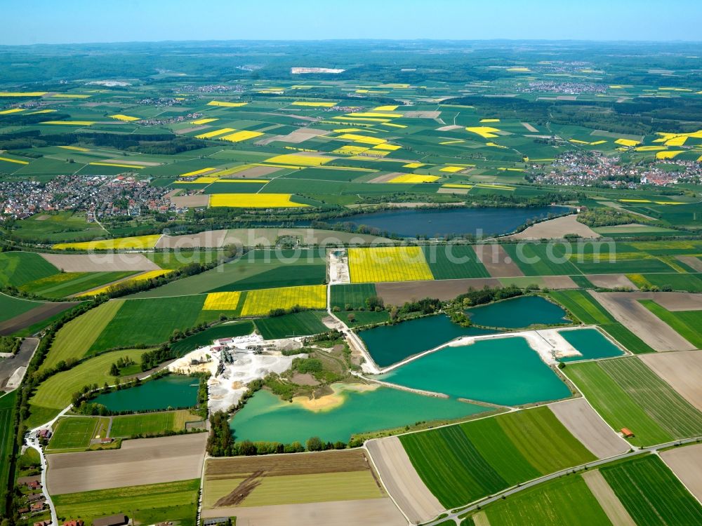 Aerial image Ehingen - The quarry pond in the Rißtissen part of Ehingen in the state of Baden-Württemberg. The lake is located in an area of agricultural fields on the Northern border of Rißtissen. The region is characterised by the river Danube and is used for fishing and as a bathing lake