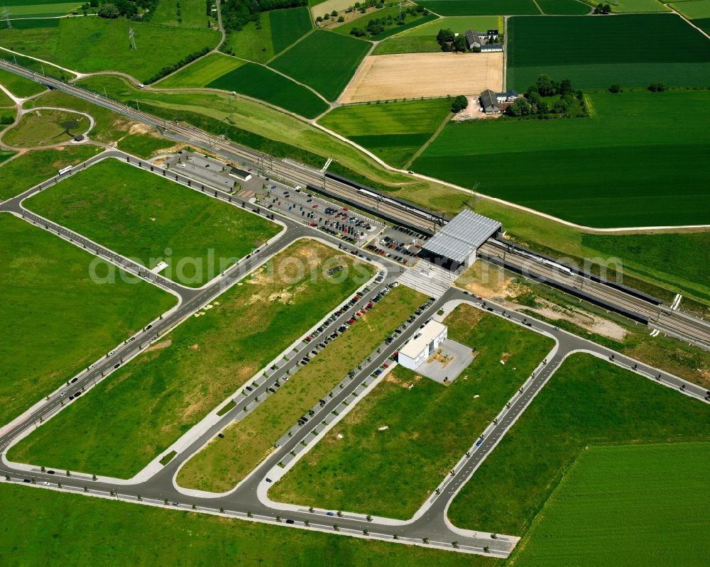 Aerial photograph Limburg an der Lahn - The train station Limburg South in Limburg an der Lahn in the state of Hessen. When the ICE fast train track of Cologne - Rhine was built, a dedicated ICE train station was purposely built in Limburg. It is located in the South of the city, enclosed by fields and has its own Park & Ride facilities