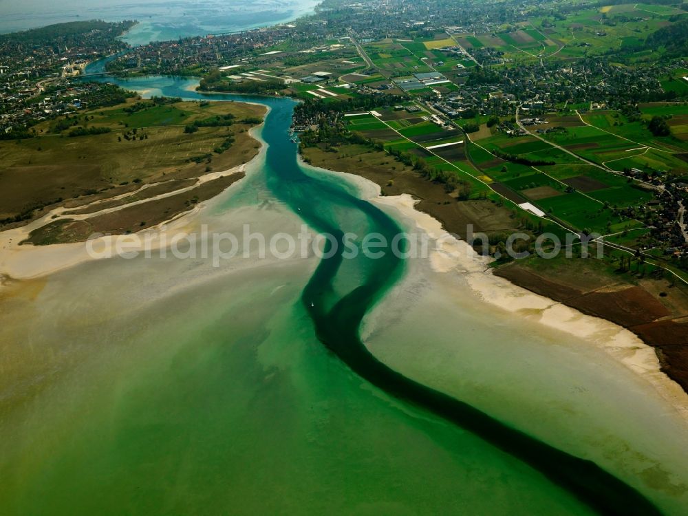 Aerial photograph Konstanz - The Lake Constance at the mouth of the river Rhine near Constance in the state of Baden-Württemberg. The varied coloration of the water of the river and the lake is distinguishable. This part of Lake Constance is the larger Obersee. The riverbank consists of gravel and sand, a natural barrier to the fields and acres