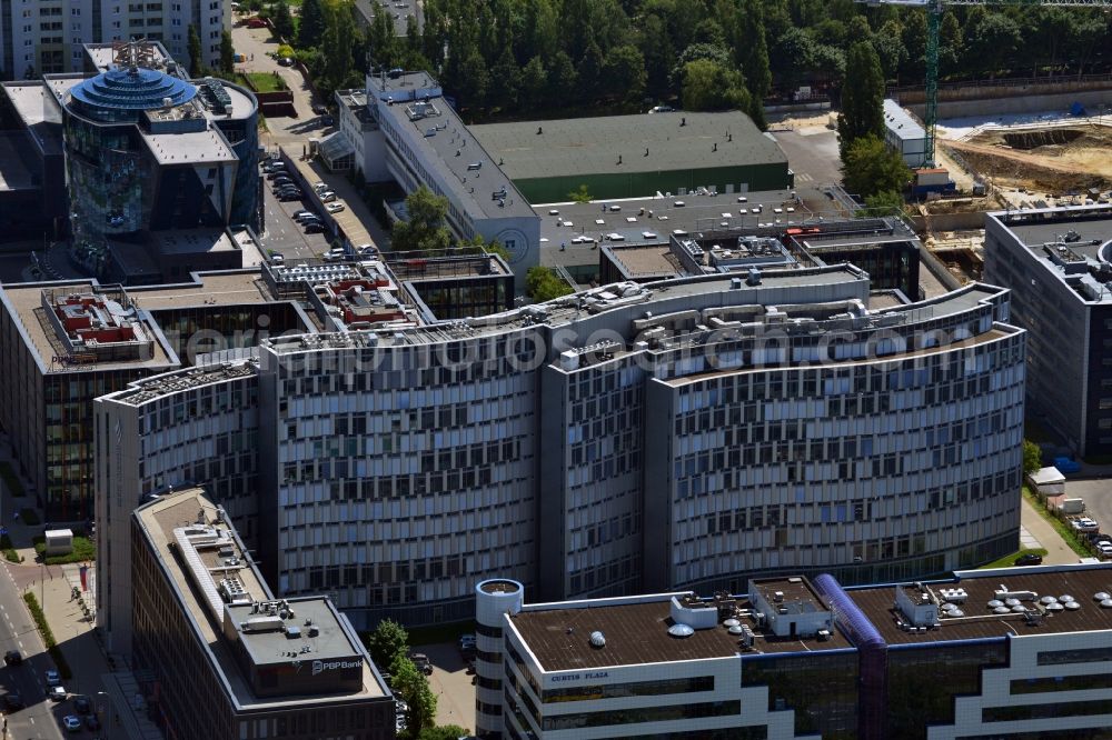 Aerial image Warschau - The office complex Horizon Plaza in the Mokotow district of Warsaw in Poland. The complex consists of two buildings - a low rise which fits into the surrounding area of the business district and which is located on Domaniewska Street - and a taller one which is known for its round shape, rippling glas facade and its roof terraces. It was designed by JSK Architects