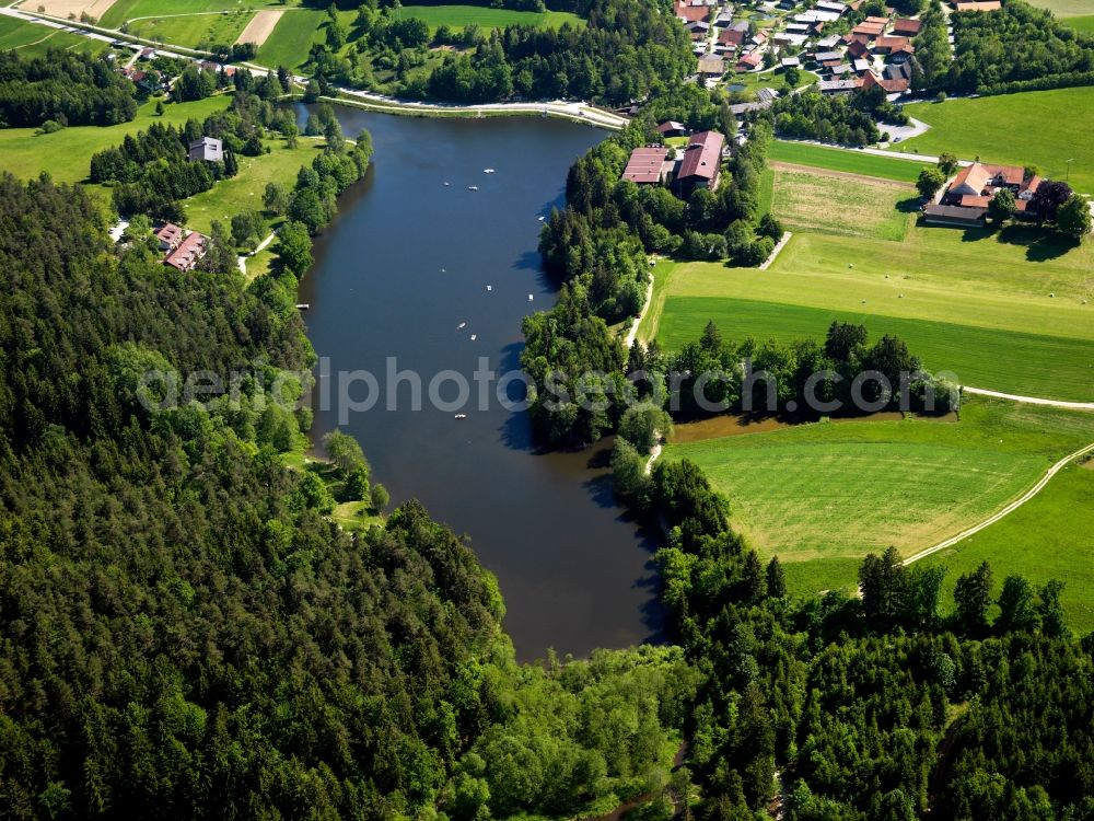 Tittling from above - The lake Dreiburgensee (Three Castle Lake) in the borough of Tittling in the state of Bavaria. The lake was originally called Rothau Lake and is located in the Bavarian Forest. It was put in place for fishing and is dammed up on one side by a street. It is a beloved leisure area in summer for swimming and in winter for ice skating