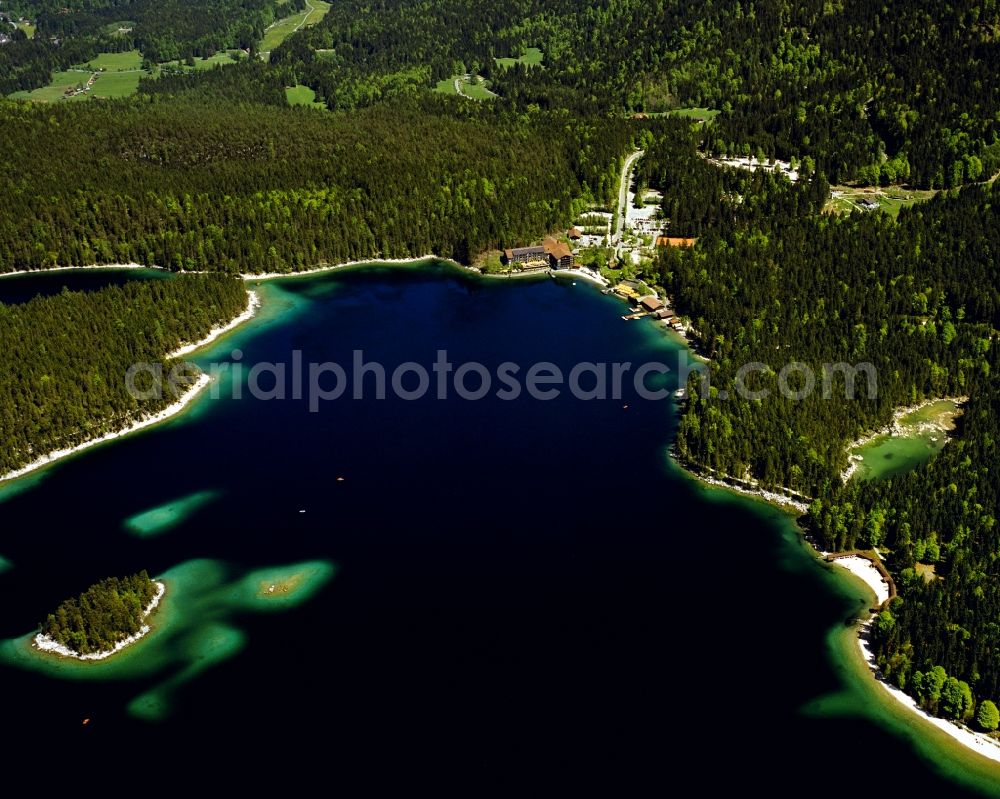 Aerial photograph Grainau - The lake Eibsee in the community of Grainau in the state of Bavaria. The lake is - due to its location below Zugspitze and its clear, green water - considered one of the most beautiful lakes in the Bavarian Alps. It is Wolfgang Gerberely owned and renowned as fishing spot