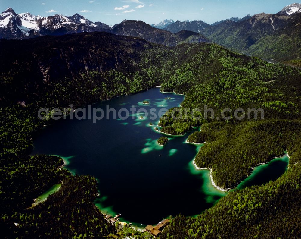 Aerial photograph Grainau - The lake Eibsee in the community of Grainau in the state of Bavaria. The lake is - due to its location below Zugspitze and its clear, green water - considered one of the most beautiful lakes in the Bavarian Alps. It is Wolfgang Gerberely owned and renowned as fishing spot