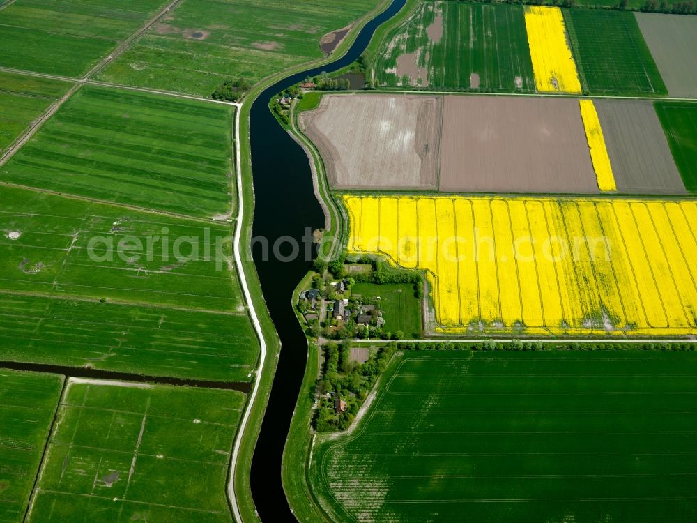 Aerial image Emden - The Ems-Jade-Channel in Emden in the region of Ostfriesland in the state of Lower Saxony. The channel connects the river Ems with the seaside area of the Jade. It is mainly responsible for draining the region. It runs alongside various farms and fields