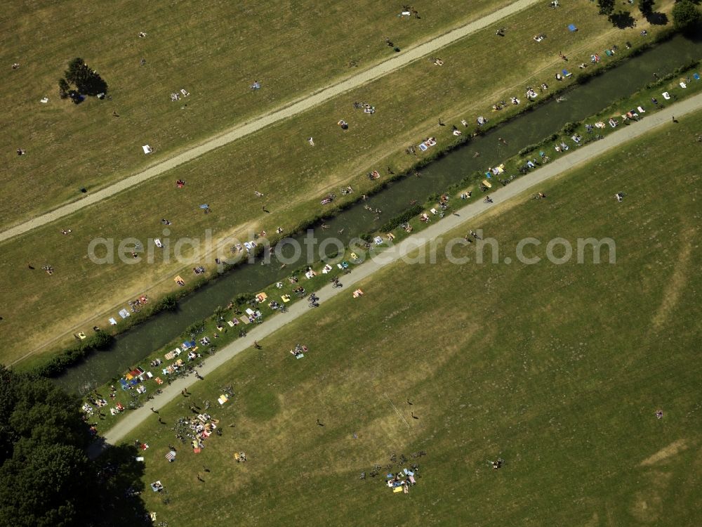 München from above - The leisure area Englischer Garten (English Garden) in Munich in the state of Bavaria. The popular greens and open spaces of the park are mainly used in summer and are administrated by the Bavarian Administration of castles, gardens and lakes. The English Garden is on of the largest inner city parks in the world