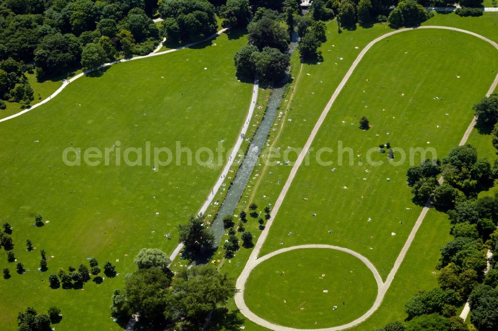 München from above - The leisure area Englischer Garten (English Garden) in Munich in the state of Bavaria. The popular greens and open spaces of the park are mainly used in summer and are administrated by the Bavarian Administration of castles, gardens and lakes. The English Garden is on of the largest inner city parks in the world