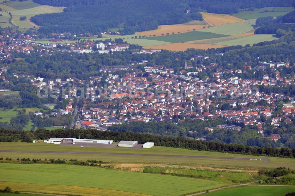 Bad Pyrmont from above - The Airport Hameln-Pyrmont and the cityscape of the Kurstadt Bad Pyrmont in the state of Lower Saxony. The town is located in Weserbergland and is a Lower Saxony State Bath. The airfield is licensed for gliders, ultra light planes, motor gliders and sporting aeroplanes