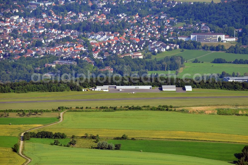 Bad Pyrmont from the bird's eye view: The Airport Hameln-Pyrmont and the cityscape of the Kurstadt Bad Pyrmont in the state of Lower Saxony. The town is located in Weserbergland and is a Lower Saxony State Bath. The airfield is licensed for gliders, ultra light planes, motor gliders and sporting aeroplanes. Visible in the background is the Bathildis Hospital