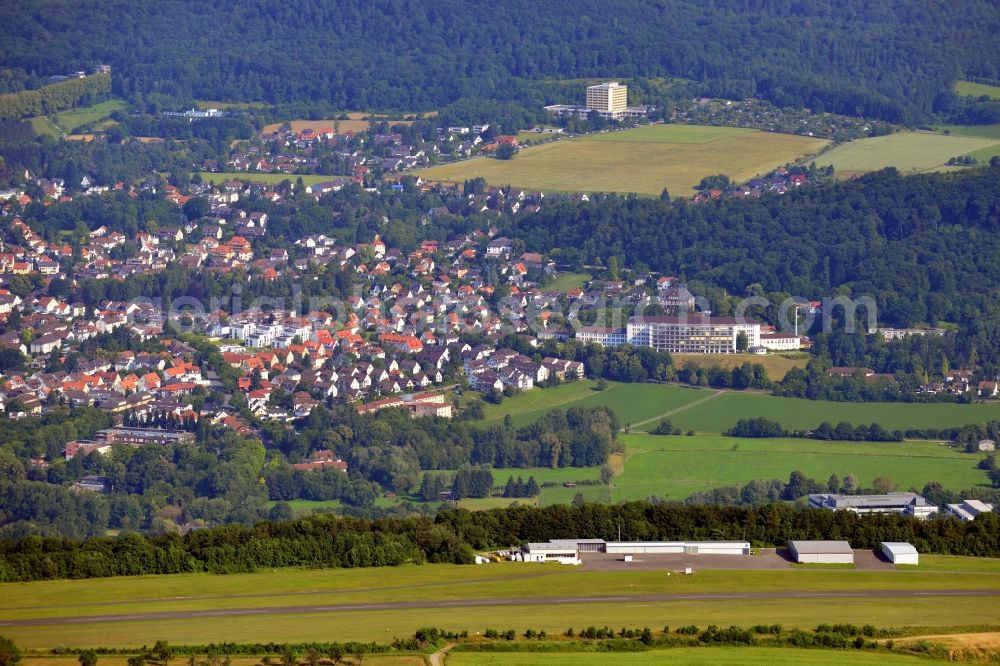 Aerial image Bad Pyrmont - The Airport Hameln-Pyrmont and the cityscape of the Kurstadt Bad Pyrmont in the state of Lower Saxony. The town is located in Weserbergland and is a Lower Saxony State Bath. The airfield is licensed for gliders, ultra light planes, motor gliders and sporting aeroplanes. Visible in the background is the Bathildis Hospital