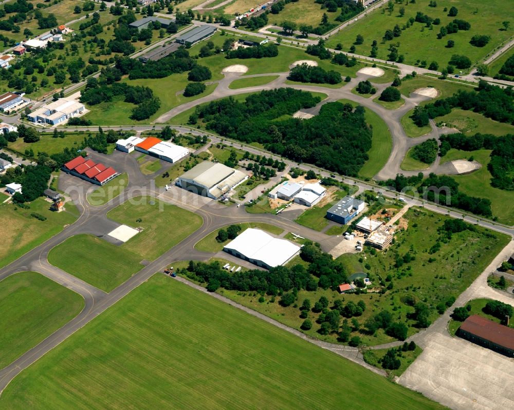 Aerial photograph Bremgarten - The airfield and industrial area Bremgarten in the Breisgau region of the state of Baden-Württemberg. The area is a former military airfield. Today it is a nature preserve. View of the runway as well as hangar and various halls