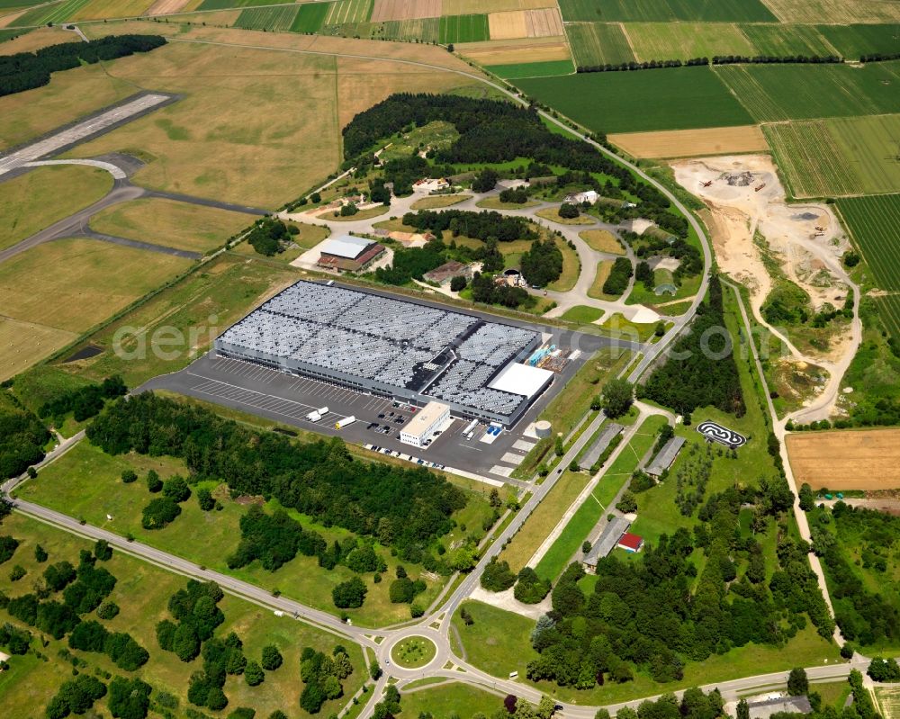 Aerial photograph Bremgarten - The airfield and industrial area Bremgarten in the Breisgau region of the state of Baden-Württemberg. The area is a former military airfield. Today it is a nature preserve. View of a hall and logistic centre of the Lidl company