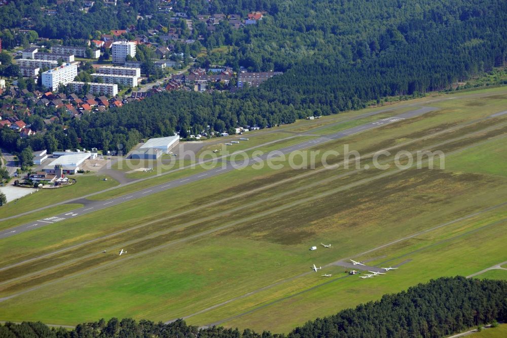 Oerlinghausen from the bird's eye view: Oerlinghausen Airfield is a small airfield in the county district of Lippe in Ostwestfalen - Lippe in the state of North Rhine-Westphalia. It is one of the largest gliding centres. There are 3 runways accommodating motor planes, gliders, microlights and hot air balloons. It is operated by the Flugplatzgemeinschaft e.V