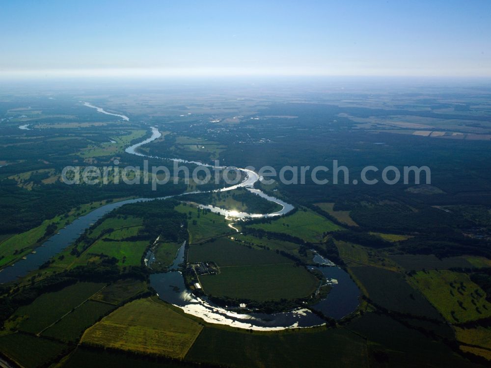 Aerial photograph Coswig - The river Elbe and the old Elbe in Coswig in the state of Saxony-Anhalt. The river runs between fields through the landscape. The visible horse-shoe-bend, which is only slightly watered, is part of the old Elbe. Visible as well is the highway A9 crossing the river