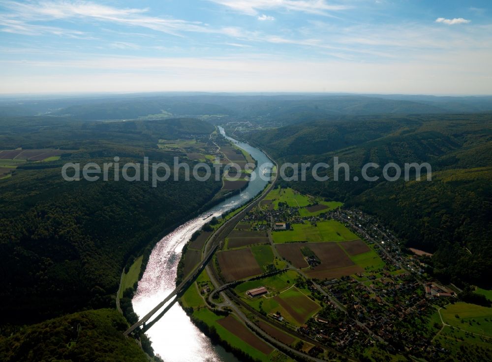 Neuendorf from above - The river Main at Neuendorf in the state of Bavaria. The river as well as the borough of Neuendorf is visible. The borough is located on its riverbank in a curve. The Main valley bridge Nantenbach stretches across the river in the area and belongs to the rail line Aschaffenburg-Wuerzburg