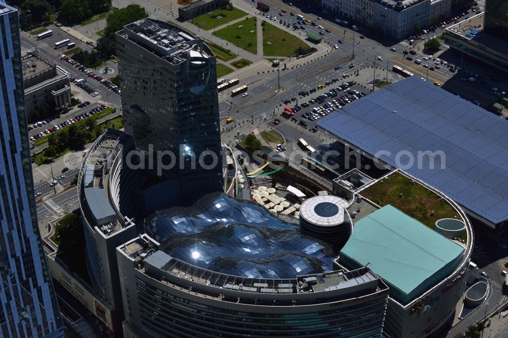 Aerial photograph Warschau - The building complex Zlote Tarasy (Golden Terraces) in downtown Warsaw in Poland. The multi-functional complex of a shopping mall, office buildings and an entertainment area was opened in 2007. It is the most expensive real estate project in Warsaw and is located adjacent of the Cultural Palace. Its landmark is the elaborate glas roof of the shopping mall. Its current owners are Rodamco Europe B.V. and ING Real Estate Asset Management