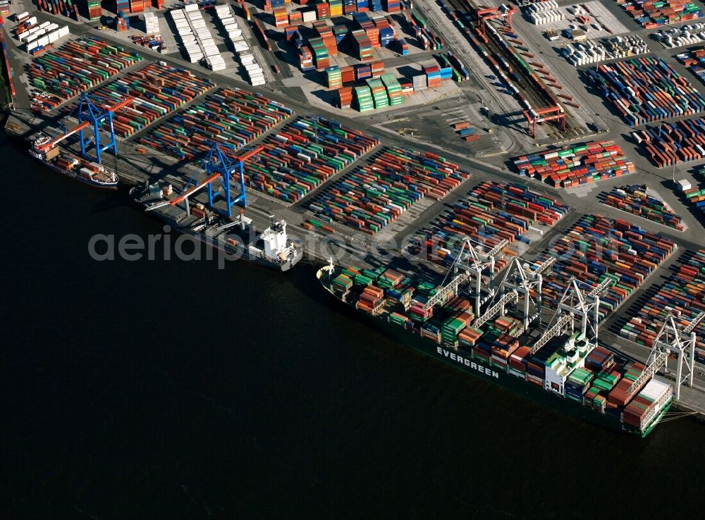 Hamburg from above - The Port of Hamburg. It is located on the river Elbe and is the largest port in Germany and the second largest in Europe. View of containers and container ships on the river Elbe