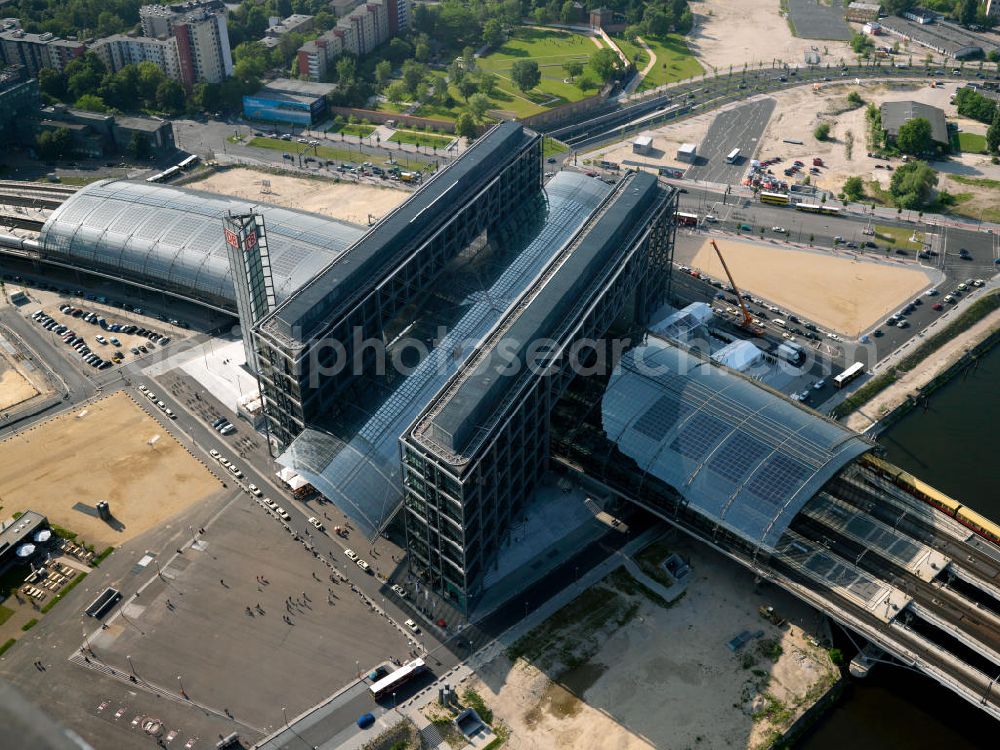 Berlin from above - The Central Station is the most important railway junction in the capital. The distinctive building was designed by architect Meinhard von Gerkan. The station building has two main levels, which serve the railways, and three connections and business levels. The station includes expanses and is therefore a major commercial real estate