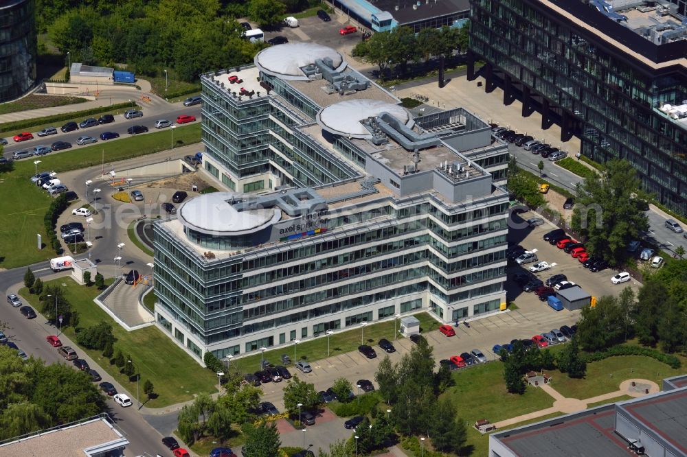 Aerial photograph Warschau - The headquarters of Ringier Axel Springer Media AG in the Mokotow district of Warsaw in Poland. The joint venture of the German and Swiss publishing houses has been created in 2010 and is located in the rectangular building in the Southwest of the district. The facility is surrounded by other office low rise buildings in the Sluzewiec part of the district