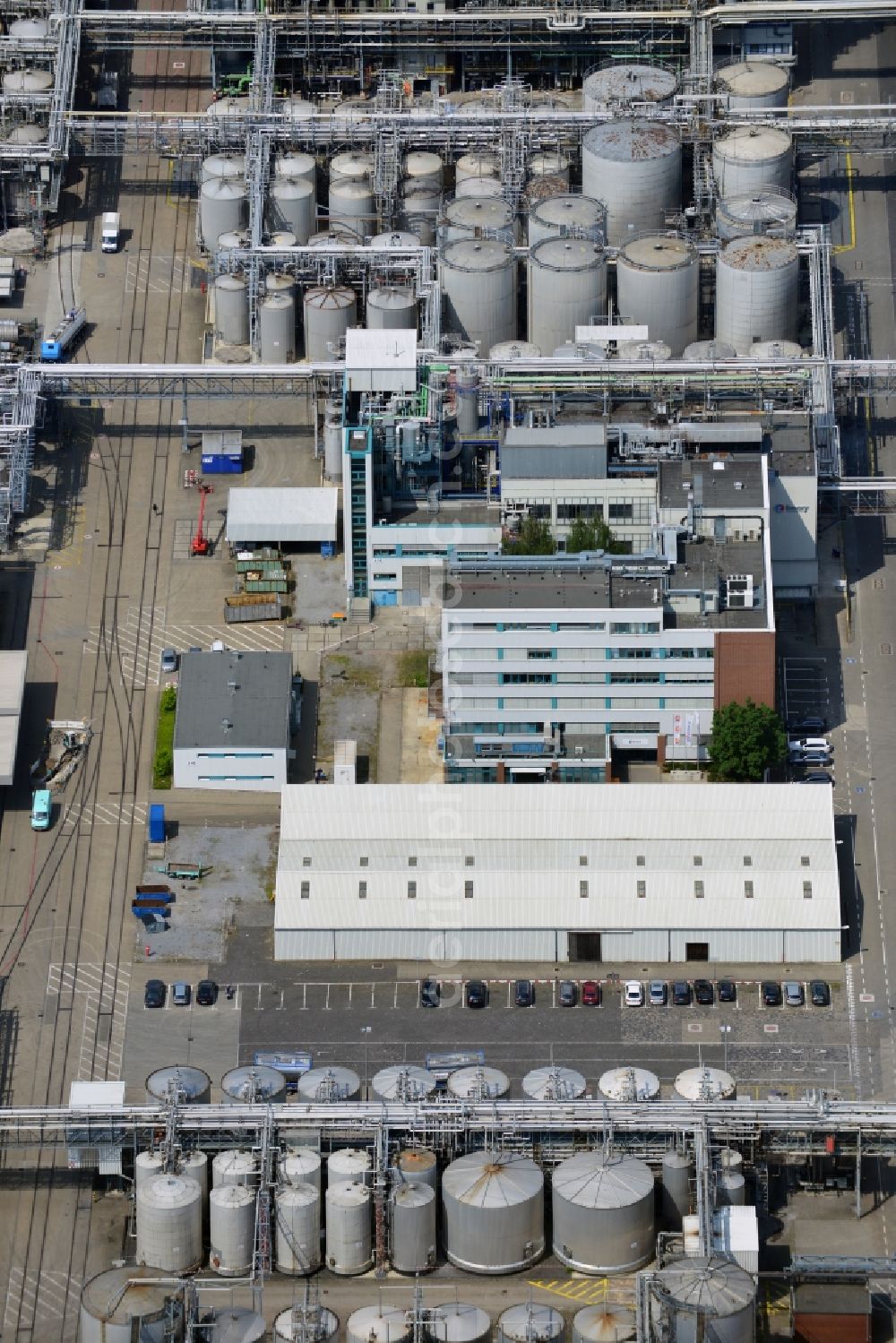 Düsseldorf from the bird's eye view: The headquarters of the Henkel company in Düsseldorf-Holthausen in the city of Duesseldorf in the state of North Rhine-Westphalia. The location is in use since 1900. Today, it is the seat of the company. Henkel operates in Home Care, Personal Care and Adhesive Technologies worldwide. On site of the industrial compound there are also facilities of the Henkel daughter company Schwarzkopf&Henkel (cosmetics and hair care), as well as a part of the BASF Group, the BASF Personal Care and Nutrition (formerly Cognis GmbH)