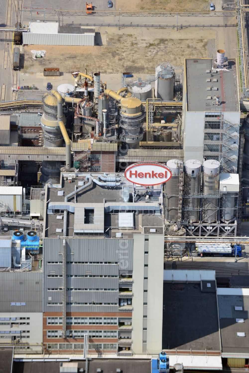 Düsseldorf from the bird's eye view: The headquarters of the Henkel company in Düsseldorf-Holthausen in the city of Duesseldorf in the state of North Rhine-Westphalia. The location is in use since 1900. Today, it is the seat of the company. Henkel operates in Home Care, Personal Care and Adhesive Technologies worldwide. On site of the industrial compound there are also facilities of the Henkel daughter company Schwarzkopf&Henkel (cosmetics and hair care), as well as a part of the BASF Group, the BASF Personal Care and Nutrition (formerly Cognis GmbH)