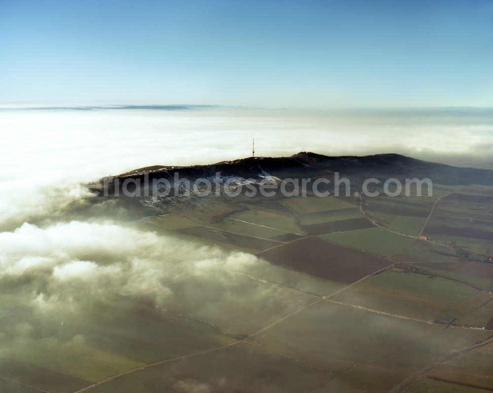 Wassertrüdingen from the bird's eye view: The Hesselberg mountain in the region of Middle Franconia in the state of Bavaria. The mountain is the highest top of the region. It is 6km long and covered by forest. It stands among fog and clouds