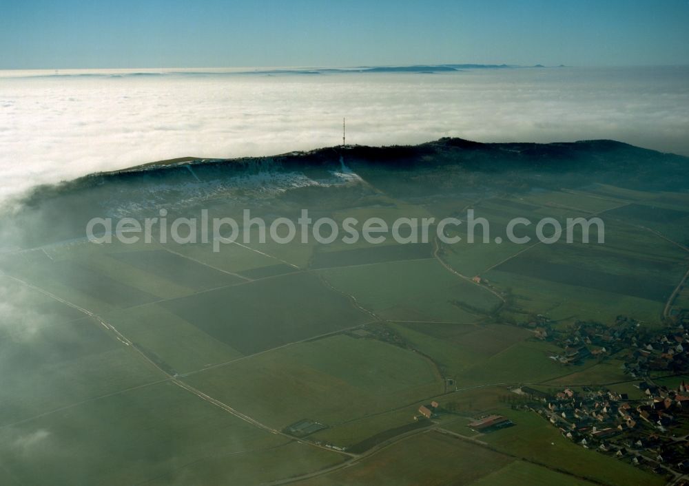 Aerial image Wassertrüdingen - The Hesselberg mountain in the region of Middle Franconia in the state of Bavaria. The mountain is the highest top of the region. It is 6km long and covered by forest. It stands among fog and clouds