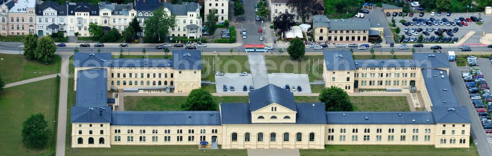 Aerial image Schwerin - Blick auf den historischen Marstall in Schwerin. Das aufwendig restaurierte Gebäude befindet sich auf einer Landzunge an der Werderstraße. Er wurde 1837 - 1842 nach Plänen von G. A. Demmler erbaut und diente als Pferdestall und Reithalle für die herzoglichen Pferde. Seit 1997 werden Teile des Gebäudes vom Technischen Museum genutzt. In den Seitenflügeln sind das Sozialministerium und das Ministerium für Bildung, Wissenschaft und Kultur untergebracht. View of the historical marstall in Schwerin.