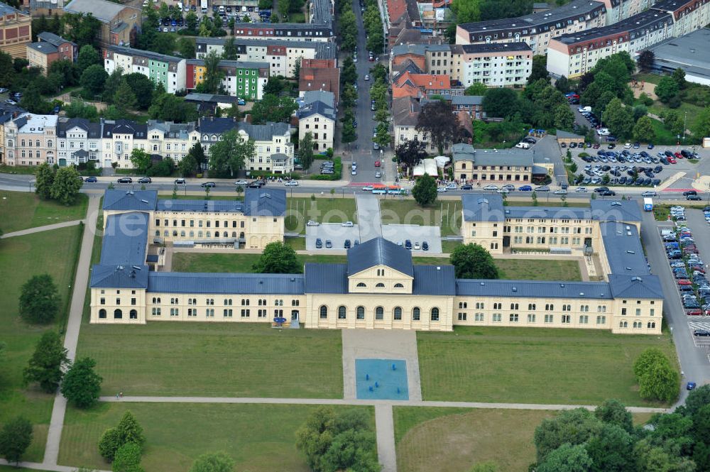 Aerial photograph Schwerin - Blick auf den historischen Marstall in Schwerin. Das aufwendig restaurierte Gebäude befindet sich auf einer Landzunge an der Werderstraße. Er wurde 1837 - 1842 nach Plänen von G. A. Demmler erbaut und diente als Pferdestall und Reithalle für die herzoglichen Pferde. Seit 1997 werden Teile des Gebäudes vom Technischen Museum genutzt. In den Seitenflügeln sind das Sozialministerium und das Ministerium für Bildung, Wissenschaft und Kultur untergebracht. View of the historical marstall in Schwerin.