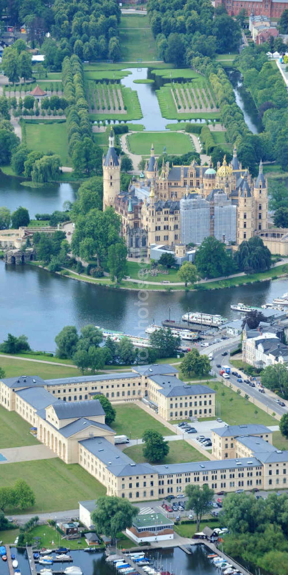 Aerial image Schwerin - Blick auf den historischen Marstall in Schwerin. Das aufwendig restaurierte Gebäude befindet sich auf einer Landzunge an der Werderstraße. Er wurde 1837 - 1842 nach Plänen von G. A. Demmler erbaut und diente als Pferdestall und Reithalle für die herzoglichen Pferde. Seit 1997 werden Teile des Gebäudes vom Technischen Museum genutzt. In den Seitenflügeln sind das Sozialministerium und das Ministerium für Bildung, Wissenschaft und Kultur untergebracht. View of the historical marstall in Schwerin.