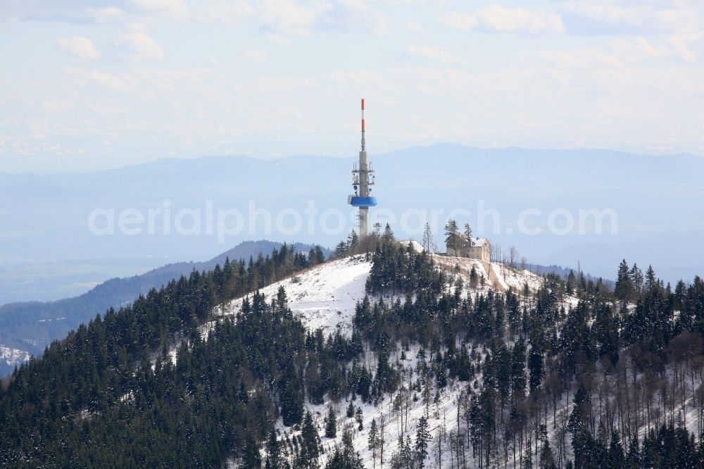 Badenweiler from the bird's eye view: Cloud-imposed is the mountain Hochblauen near Badenweiler in the state of Baden-Wuerttemberg. Mountain hotel and television tower in winter landscape in tehe Black Forest