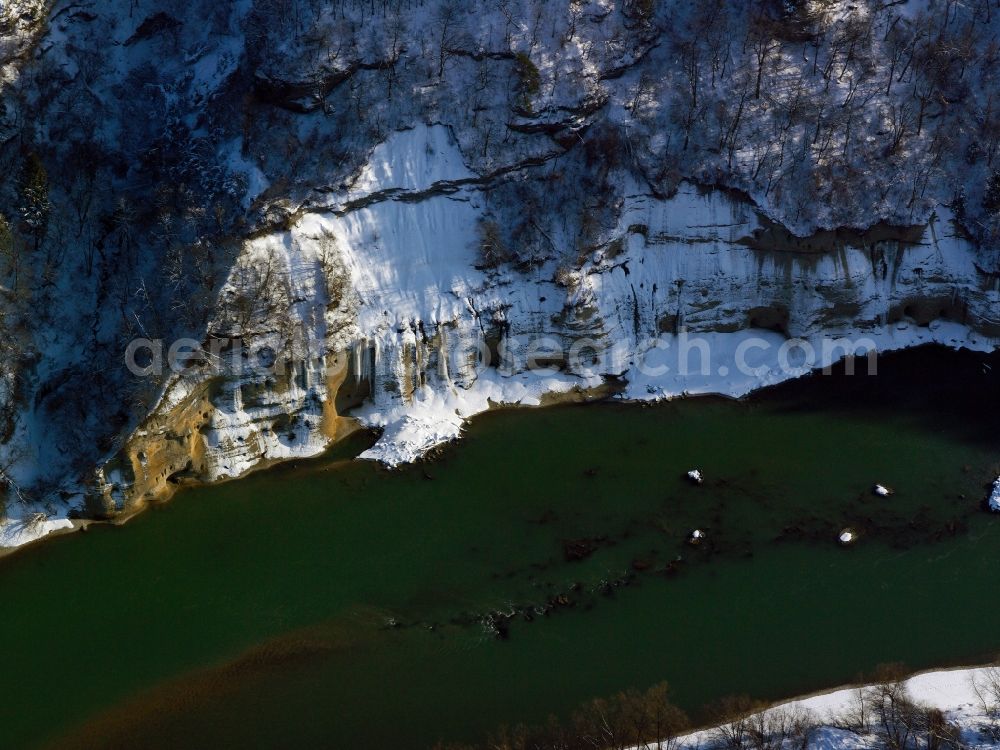 Aerial image Altötting - The river Inn in the county district of Altötting in the state of Bavaria. The river runs along a snow covered, steep rock wall. Further to the East it will run into Austria again