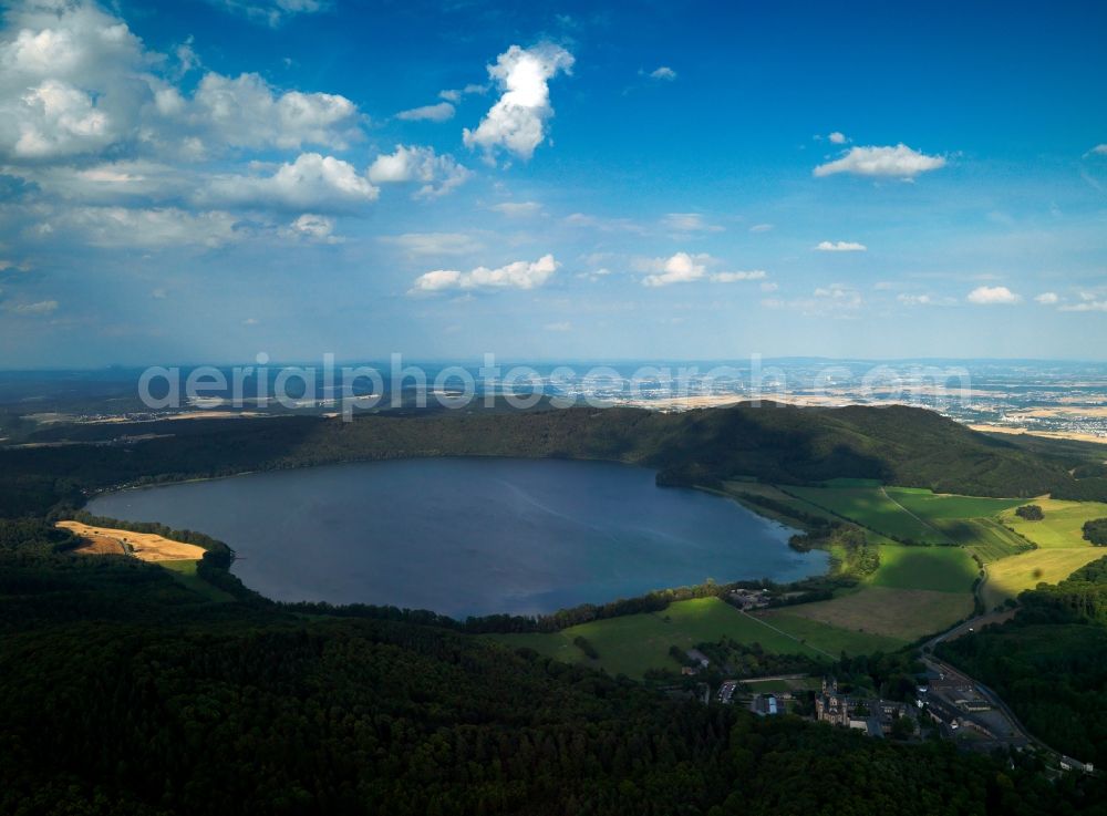 Aerial photograph Glees - Lake Laacher See in the borough of Glees in the state of Rhineland-Palatinate. The lake originated from a volcano caldera. It is the largest lake of the state. It belongs to the near abbey of the Benedictians Maria Laach and is a nature preserve area. It is used as a recreational area and one of the attractions of the volcano park of the volcanic Eifel region