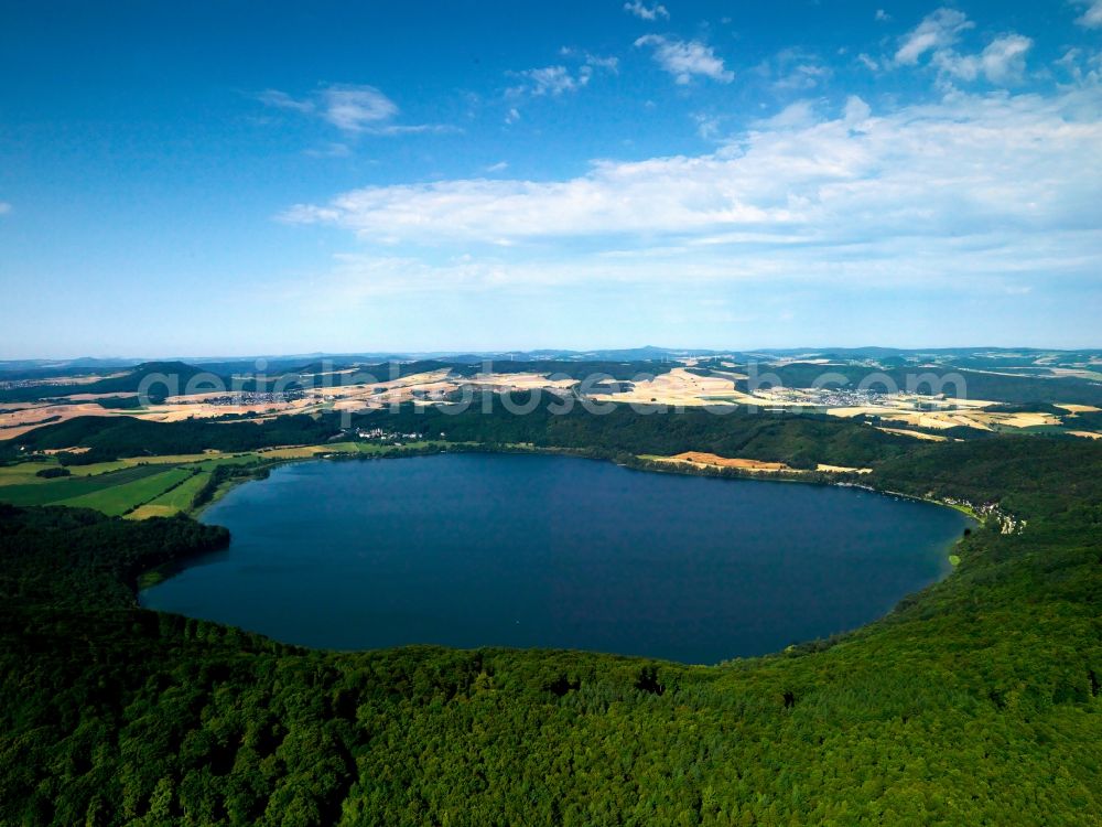 Glees from above - Lake Laacher See in the borough of Glees in the state of Rhineland-Palatinate. The lake originated from a volcano caldera. It is the largest lake of the state. It belongs to the near abbey of the Benedictians Maria Laach and is a nature preserve area. It is used as a recreational area and one of the attractions of the volcano park of the volcanic Eifel region