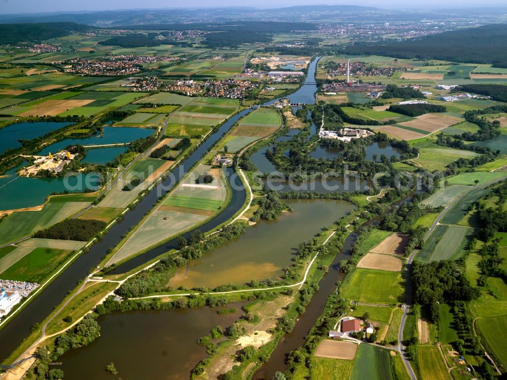 Forchheim from the bird's eye view: The Main-Danube-Channel in Forchheim in the state of Bavaria. Forchheim is a large district town in Upper Franconia located on the channel. It is part of the economy region of Bamberg-Forchheim. The channel is also called Rhine-Main-Danube-Channel because of its significance as a water road for seagoing vessels