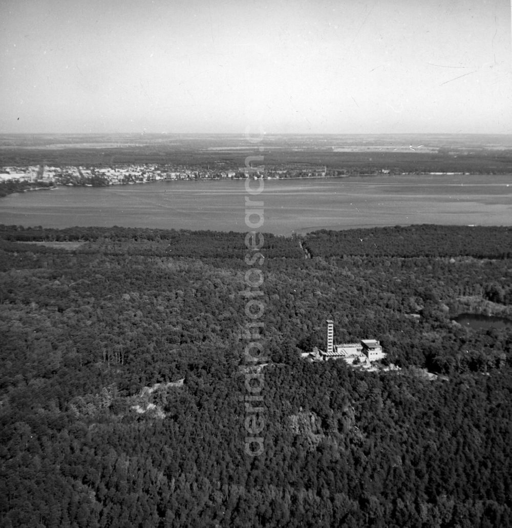 Berlin from the bird's eye view: The Mueggelturm in the Koepenick Buergerheide in Berlin in the state of Berlin. To the right of Mueggelturm is the Devil. The Mueggelturm is a well known tourist destination. It is south of the Great Mueggelsee in the Mueggelbergen on the small Mueggelberg