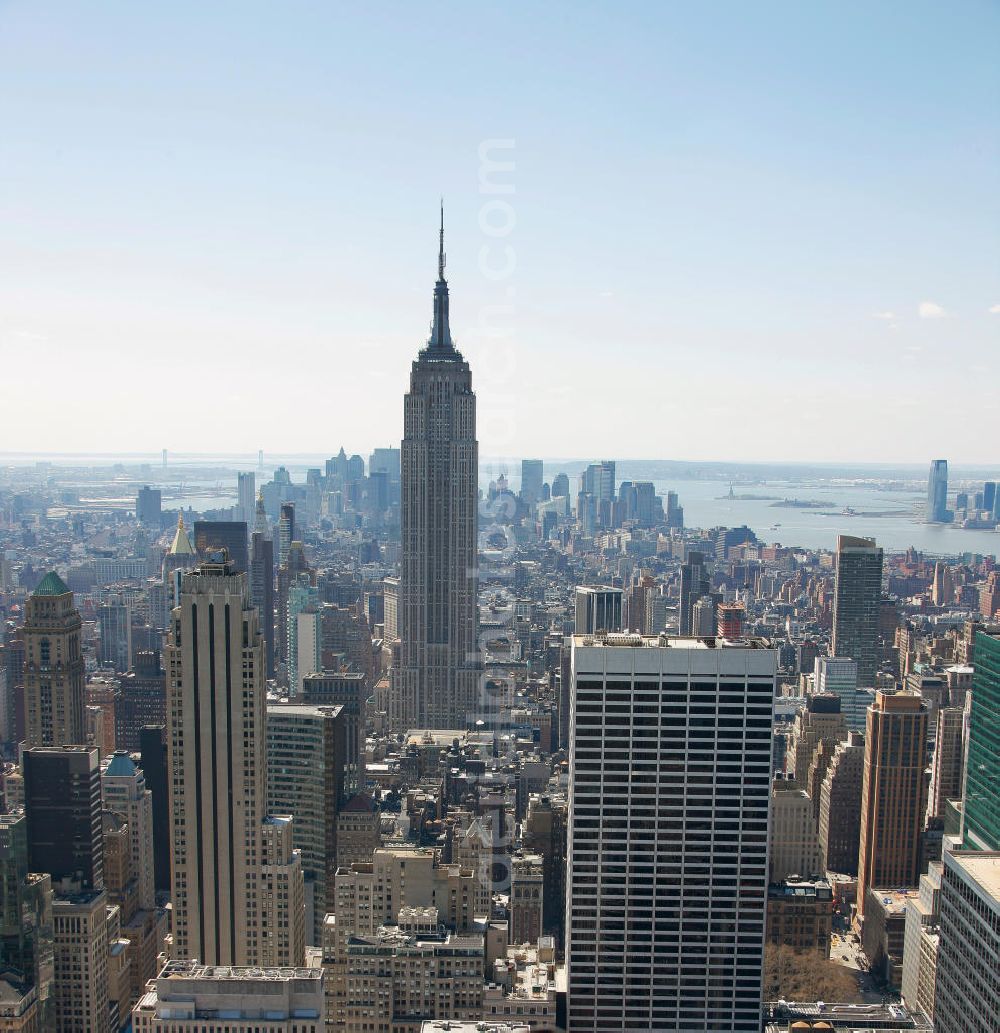 New York from above - View of the Midtown district of Manhattan in New York with the Empire State Building, the Bank of America Tower and the Rockefeller Center. The Plaza District is an important financial district in New York City and is considered as the largest commercial center of the United States