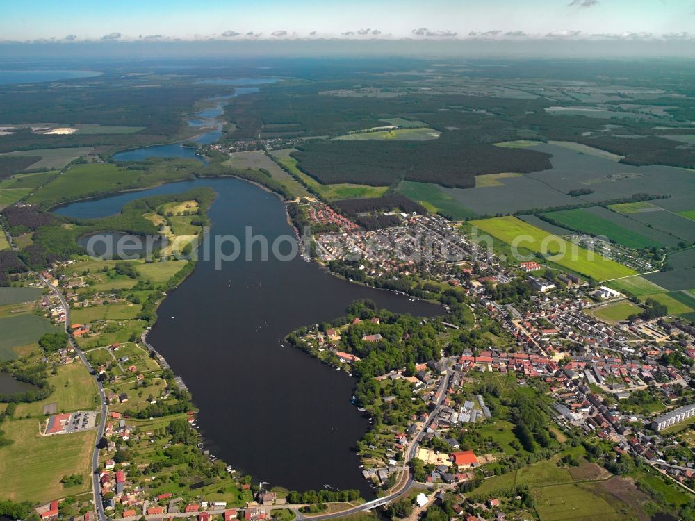 Aerial photograph Mirow - Lake Mirow in the state of Mecklenburg-Vorpommern. The lake is part of the Mecklenburg Lake District and belongs to the water and shipping office Eberswalde. The lake, surrounded by forest, fields and meadows as well as the town of Mirow has a length of 2.5 km